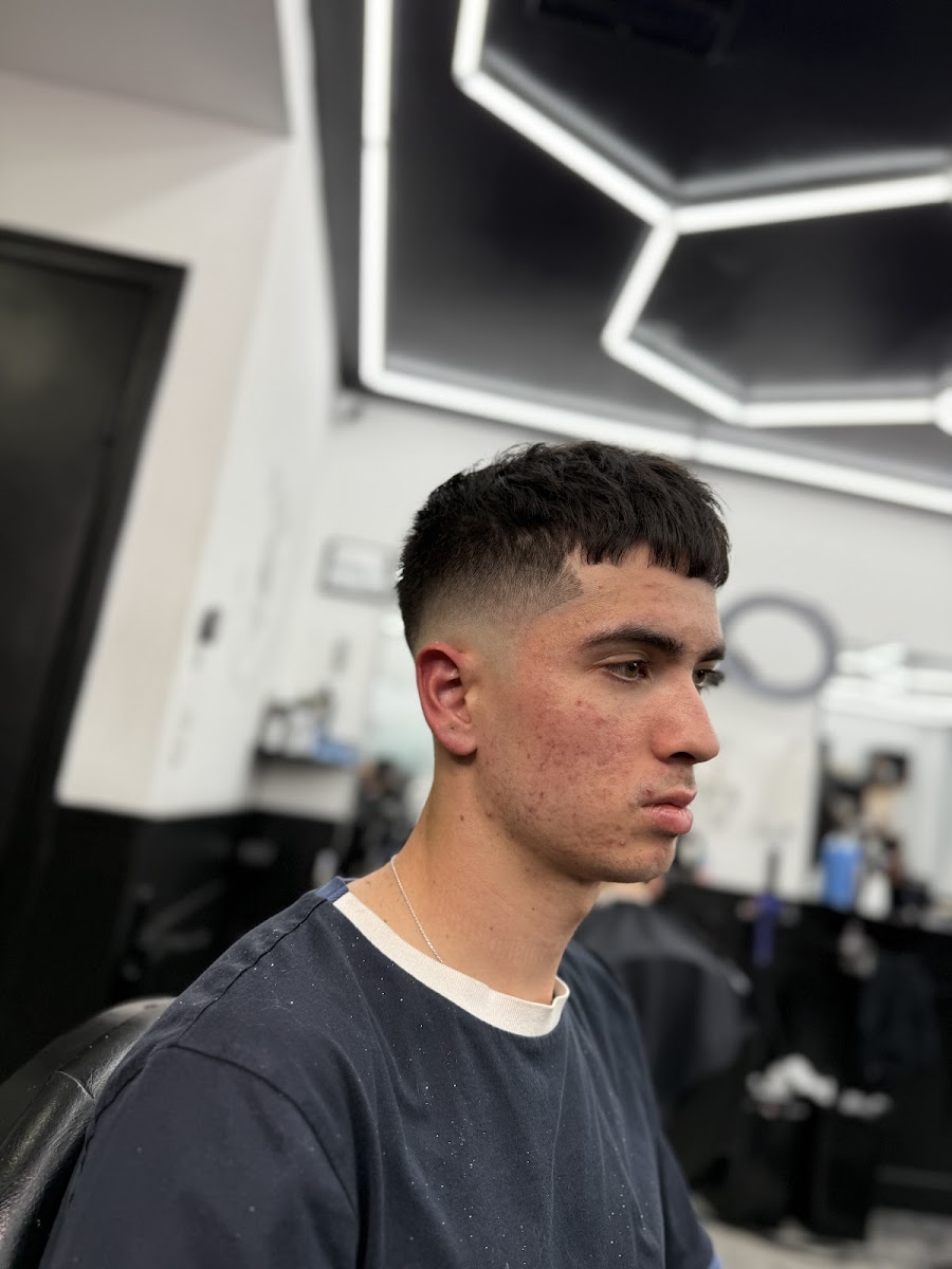 Skin fade with the hex ceiling lights in the background