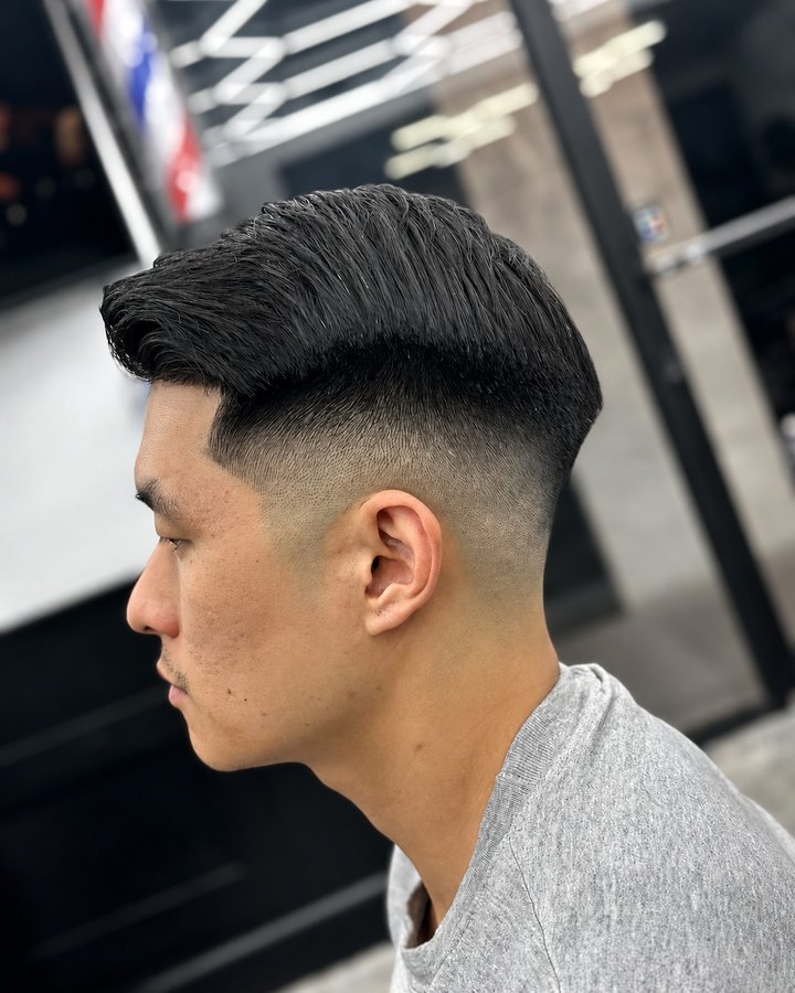 Slick-back with skin fade and hard part line